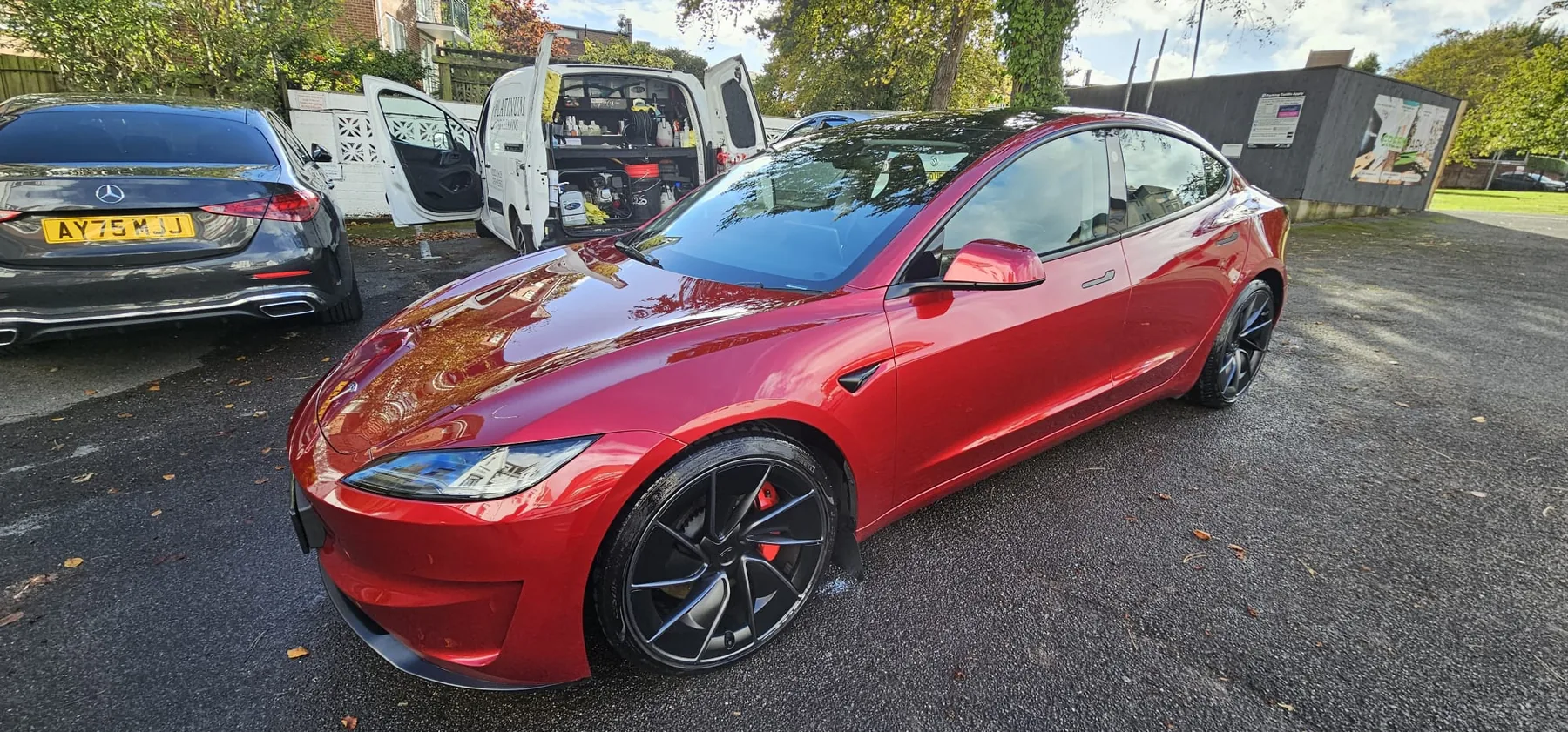 Red Tesla cleaned by Platinum Car Cleaning